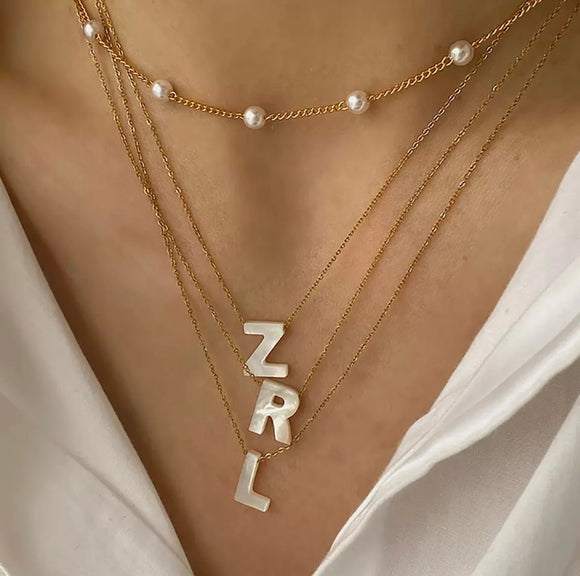 Initials in mother-of-pearl